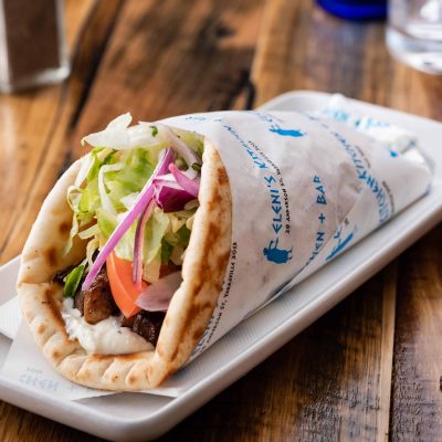 plate of lamb gyros souvlaki wrapped in Eleni's kitchen and bar paper